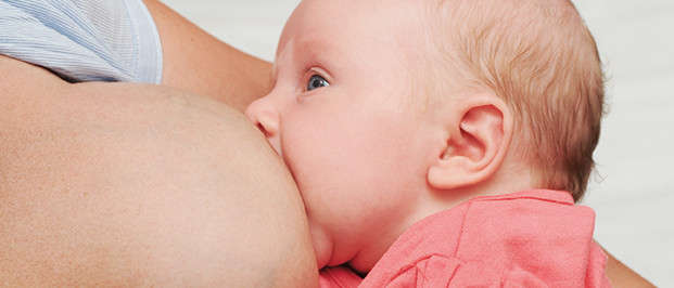 Photo of a baby breastfeeding 