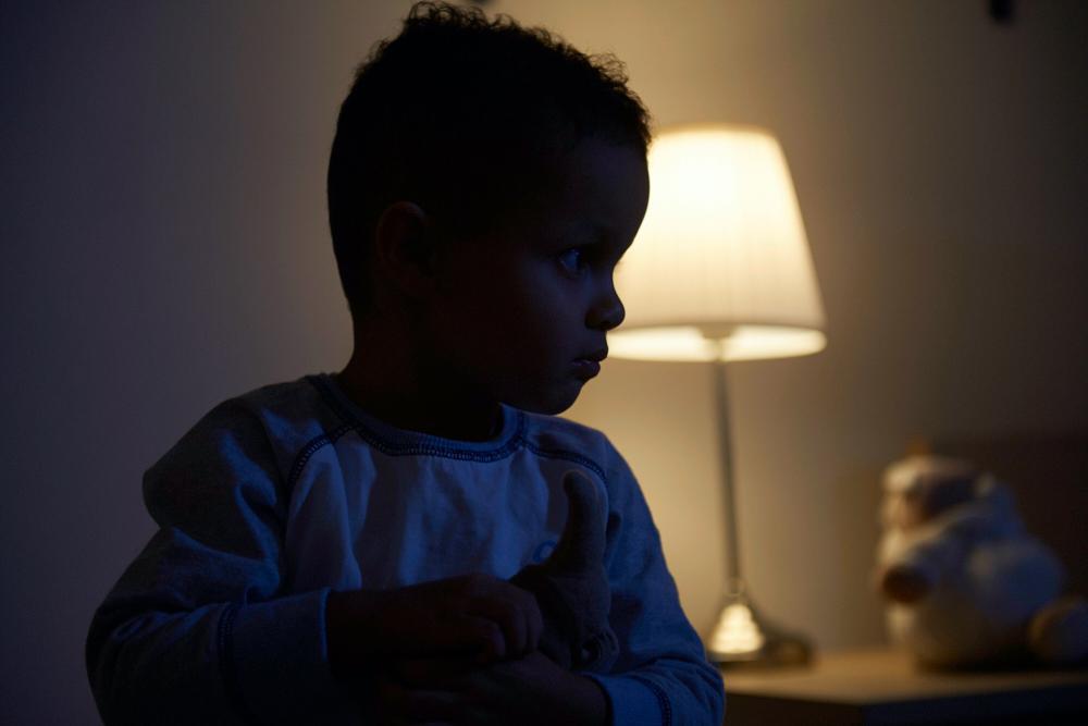 photo of toddler awake in the dark