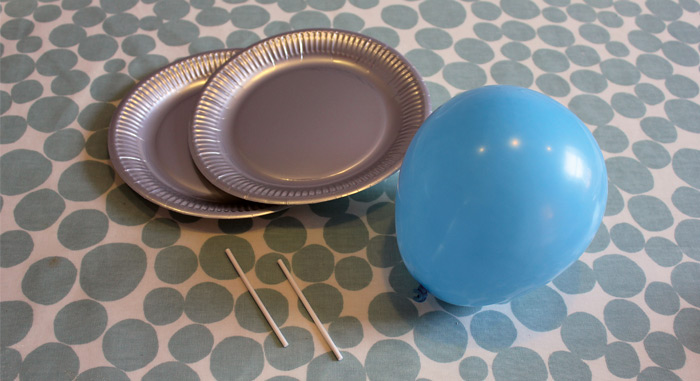 Photo of paper plates an a balloon 
