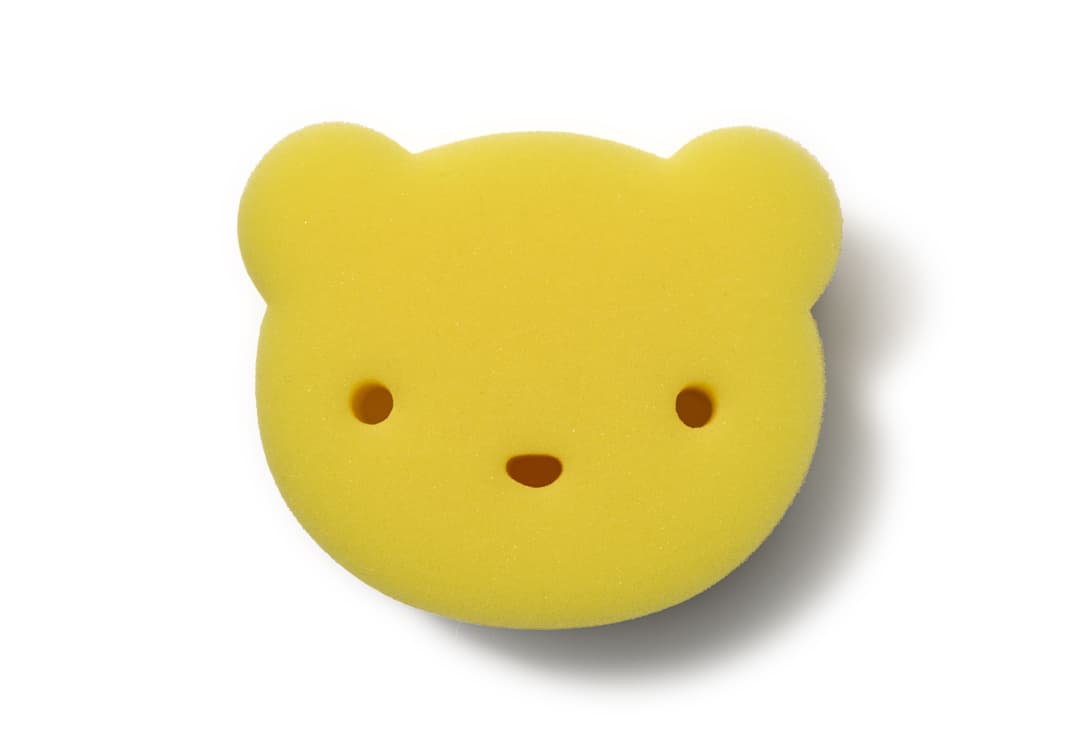 Yellow sponge from the Baby Box in the shape of a teddy bear's face