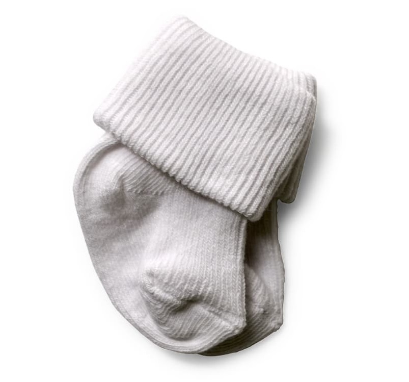 Pair of white baby socks from the Baby Box